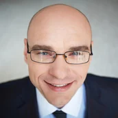 c8fa7c6f-f6b4-446f-a762-2ae3b721b6a8-close-up-male-executive-with-glasses.jpg